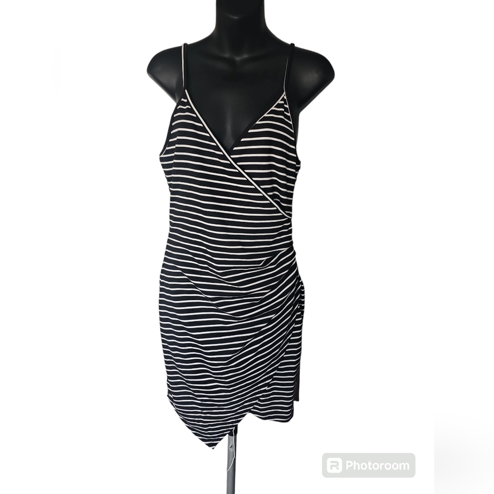 Asymmetrical striped dress with pleats on the waist line...